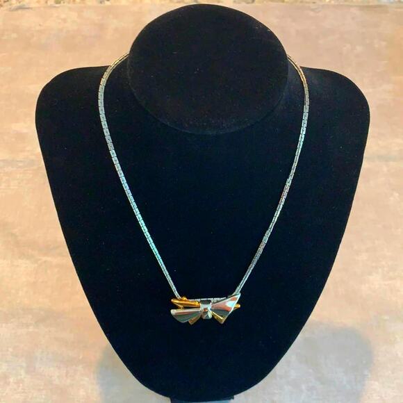 Monet Jewelry - Elegant Silver and gold Monet necklace, Bow shaped pendant, Vintage